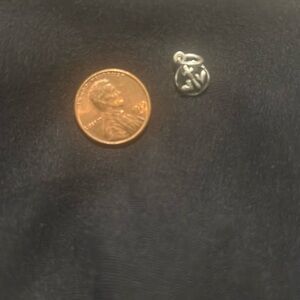 Sterling silver charm.